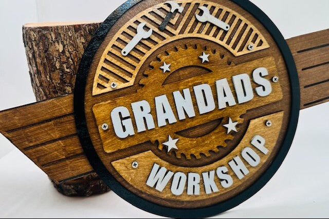 Wooden sign with 'Grandad's Workshop' text on a white background