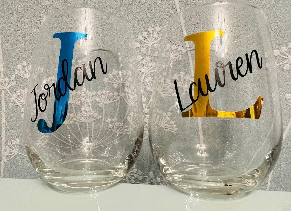 Two personalized couples stemless wine glasses with names 'Jordan' and 'Lauren' 