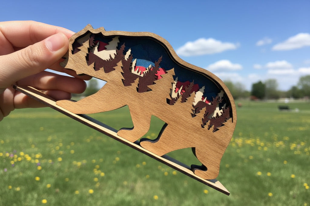 Wooden bear-shaped cutout with cut-out figures against a blue sky and green field background