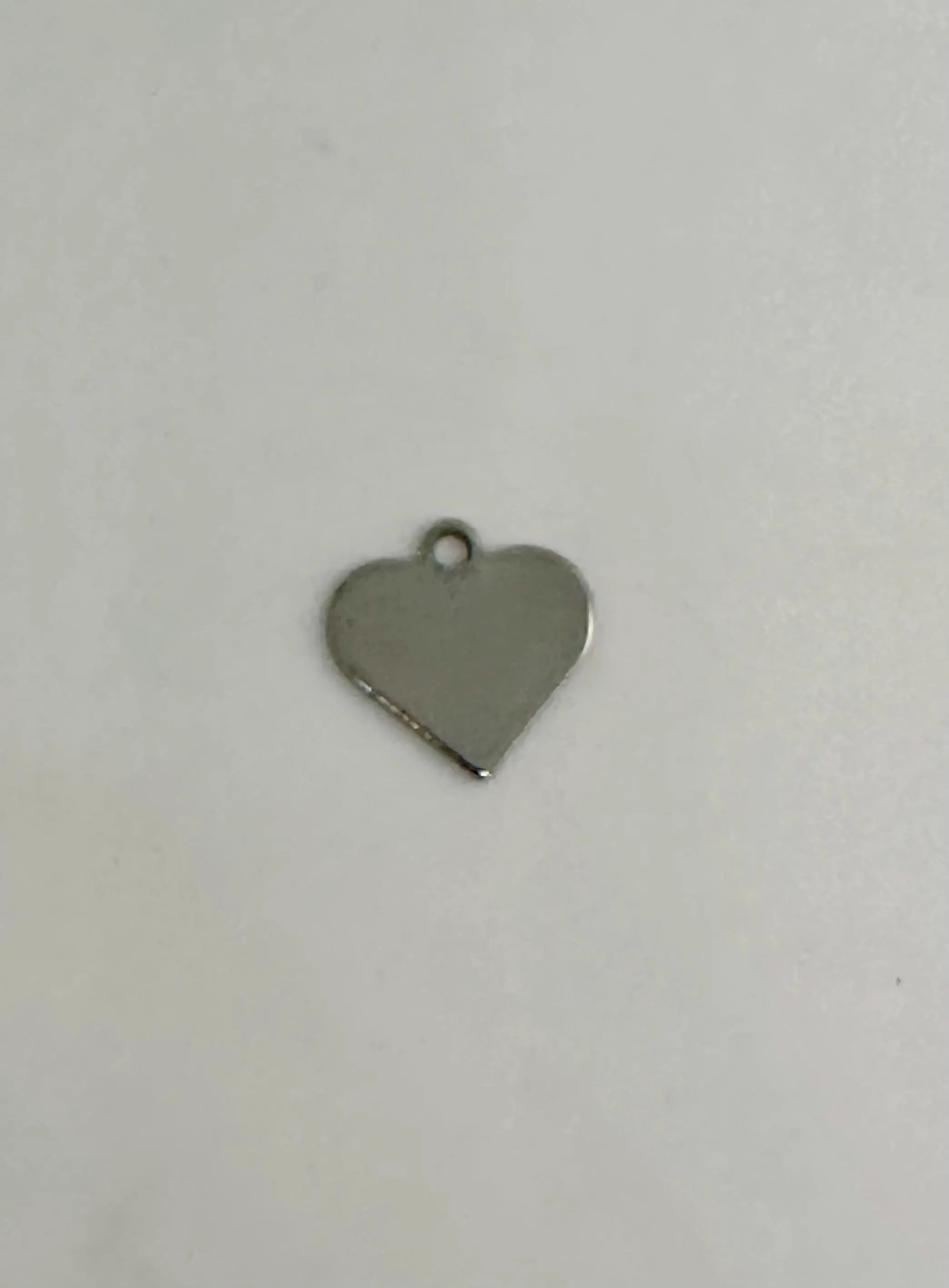 Heart-shaped metal pendant