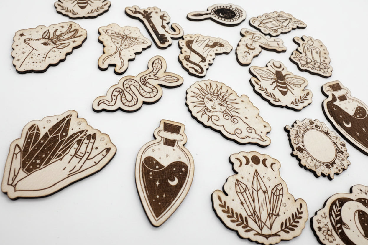 Collection of wooden magnets with mystical and celestial designs