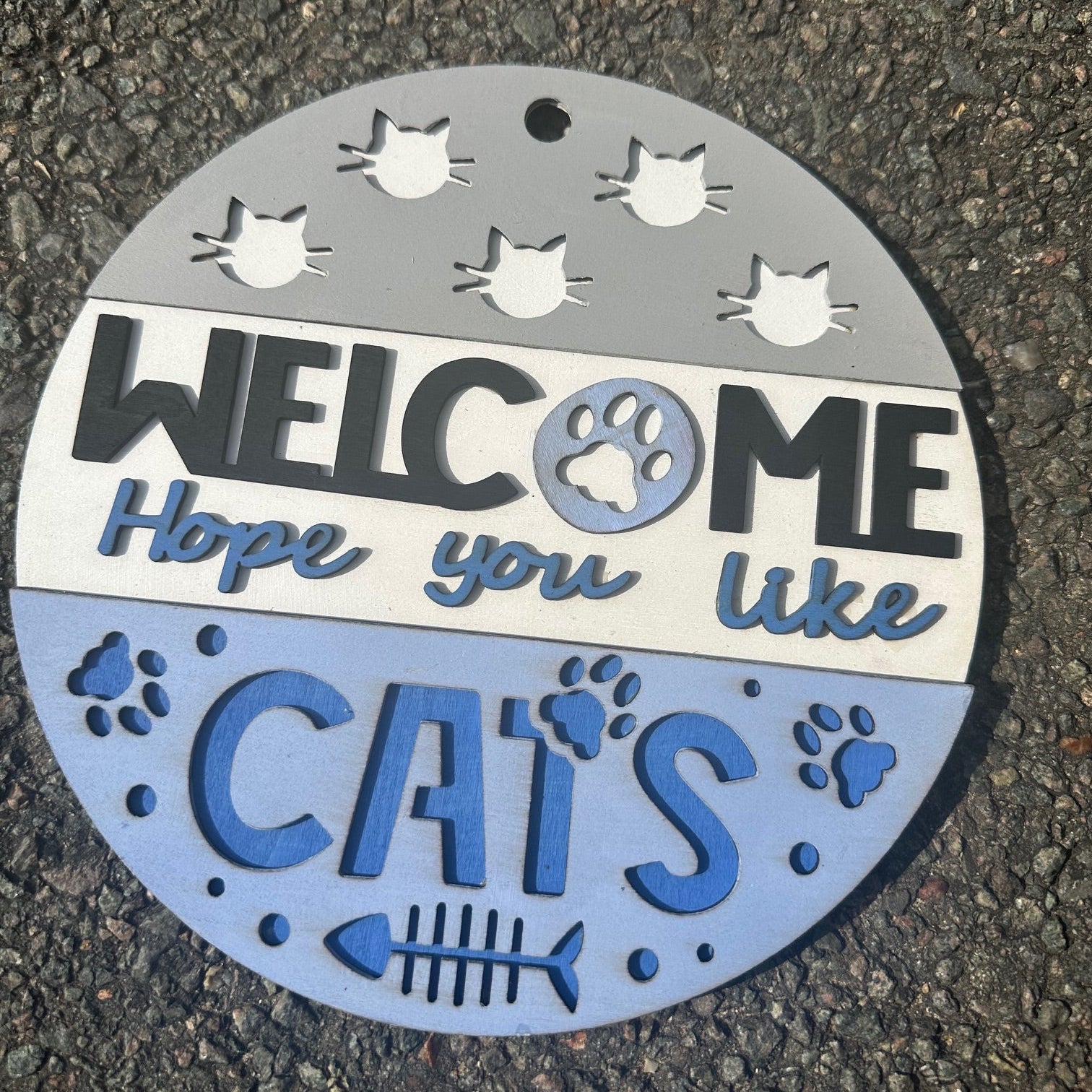 Decorative sign with 'Welcome' and 'Hope you like cats' text on