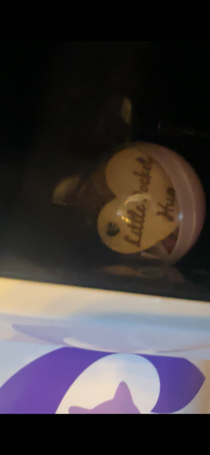 Small capsule filled with prizes that has been won from a capsule vending machine